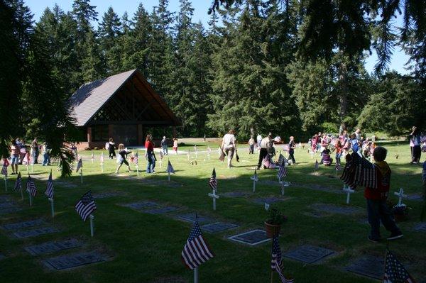 Our community helping with placement of Crosses and Flags for Memorial Day