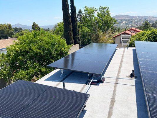 Solar panels on a flat roof. Other companies were charging an extra fee except for Bundle