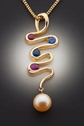 One of a kind multicolored sapphire, ruby and pearl pendant.