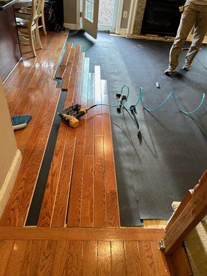 The start of the floor project in the family room.