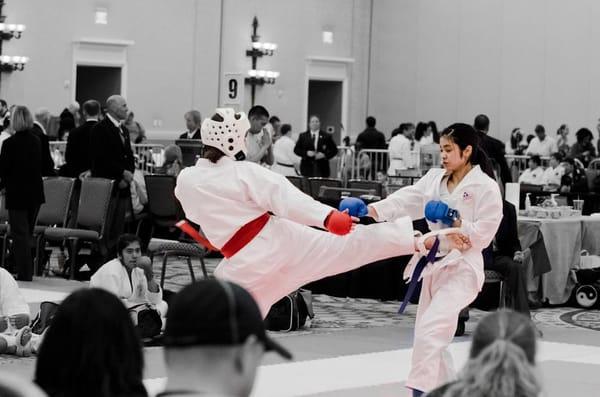 Kiera kicking her way to the gold medal. The impact of her powerful roundhouse kicks could be heard two rings away as she scored