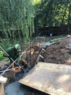 Retaining wall footings