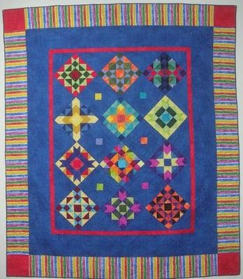 Mary, the owner, has a color class. This is the quilt from the squares you make in the class.