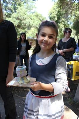 The birthday girl is proud of her goblet