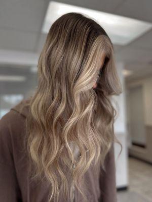 This is a lived in blonde with a bold money piece! If you love this look book a full or partial balayage.