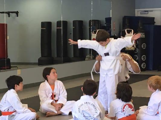 Getting first stripe. They are so proud. Adorable.