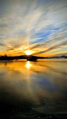 Sunrise today in Meredith, New Hampshire. Lake Winnipesaukee is starting to freeze