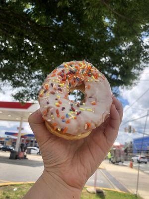 Vanilla Frosted Donut with rainbow sprinkles