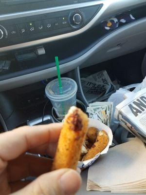 Burned mozzarella sticks. Look at the charred end of it. How tasty is that? Disgusting!!! People should not be cooks for allowing that.