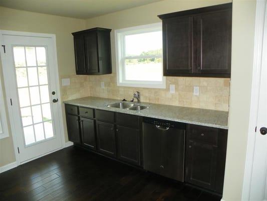 Granite, hardwoods, tile backsplash, stainless appliances, and more!!!