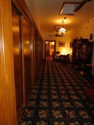 Looking down the hall from room 1 & 15, shower rooms on the left and rooms 2 & 3 on the right.