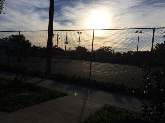 The tennis courts abut the playground area