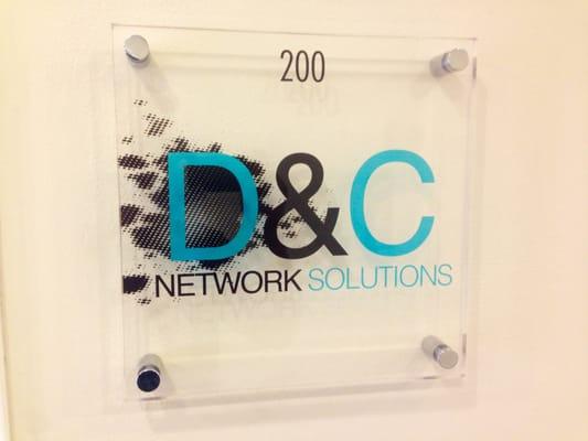 D&C Network Solutions Acrylic Door Sign Logo.