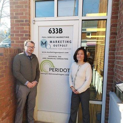 Office open! Pictured: John Michael Kledis of Peridot Consulting and Mari Peterson, Marketing Outpost