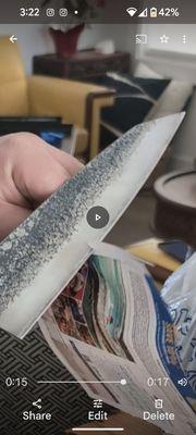 Japanese sharpened gyuto cutting paper