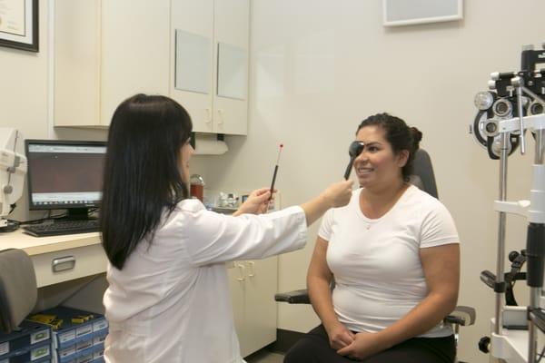 Dr. Tang is doing cover test on a patient