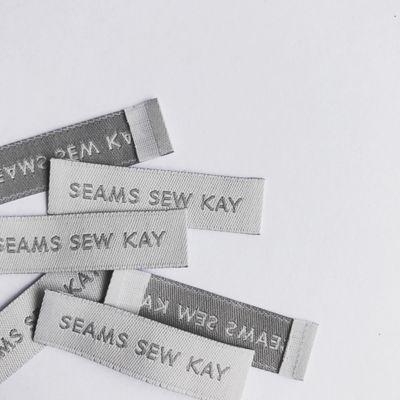 Seams Sew Kay: This is a WOVEN LABEL on damask material finished with an end fold.