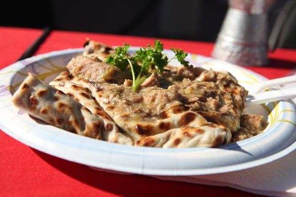 Chili Verde Crepe, made with pork, simmered in green chili sauce.