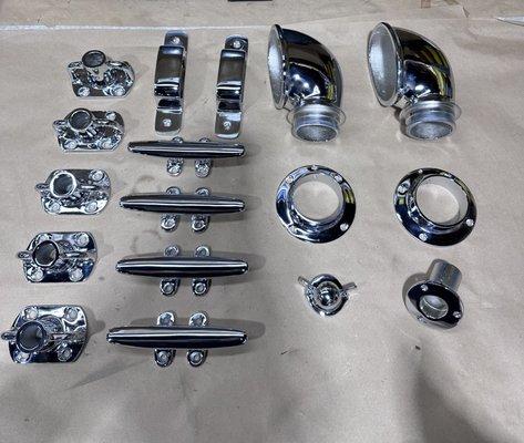 Polished Chrome flag holders ,mounting brackets, vents , cleats , bases, covers for a boat