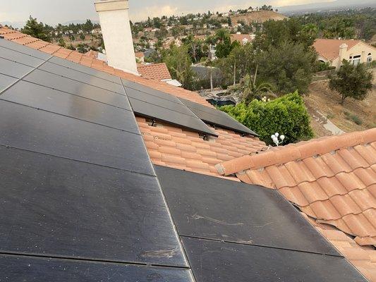 Solar panels before cleaning and Solar panel kit, mesh system installation.pigeons were living underneath creating an unhealthy nvironment.