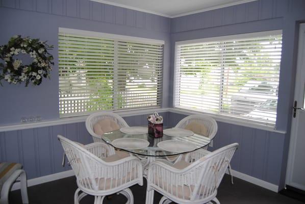 We installed Custom Faux White Wood Blinds for this beautiful Sun Room.