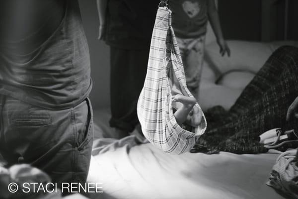 Baby being weighed during a home birth in Santa Ana, CA.